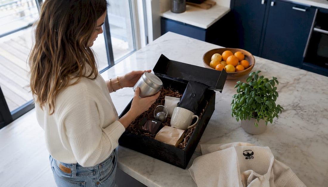 Woman unboxing coffee and tea gift basket