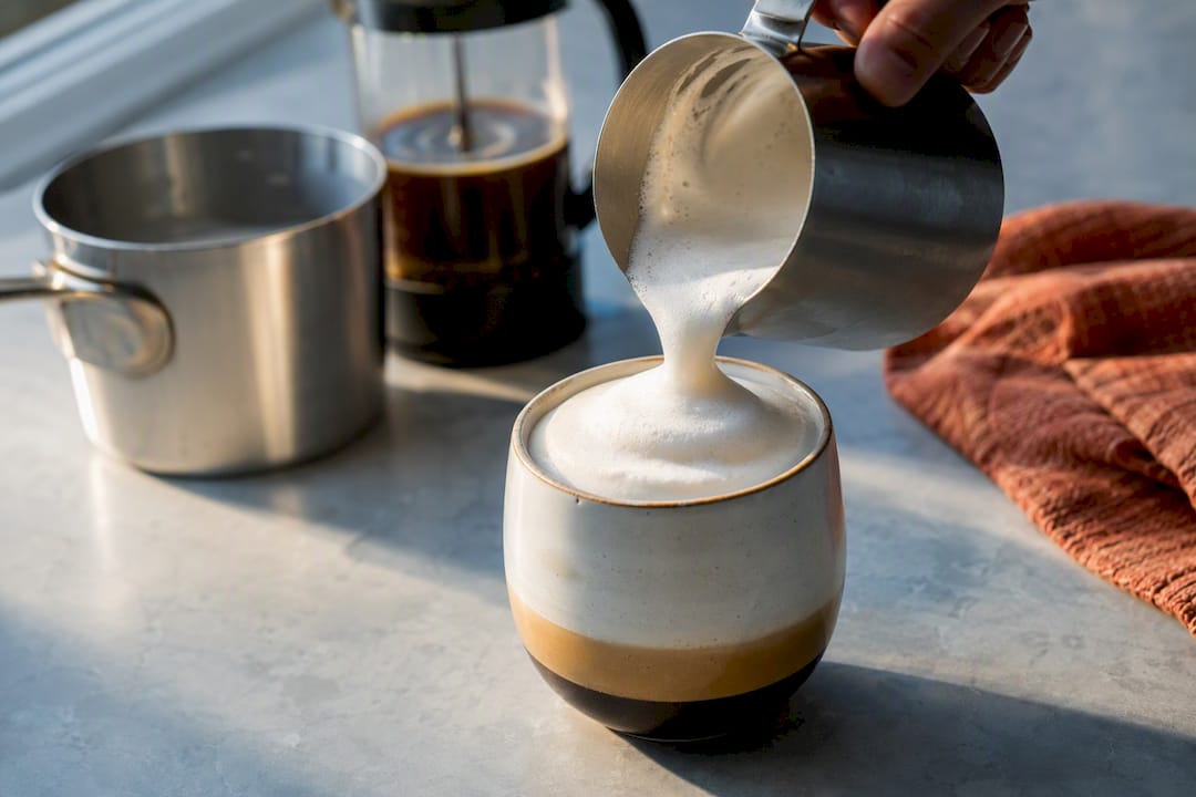 Homemade cappuccino assembled with simple kitchen tools