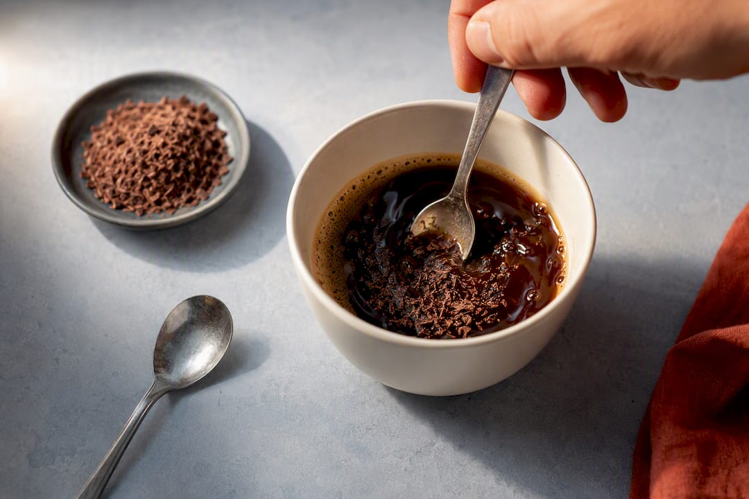 Chocolate dissolving into hot coffee